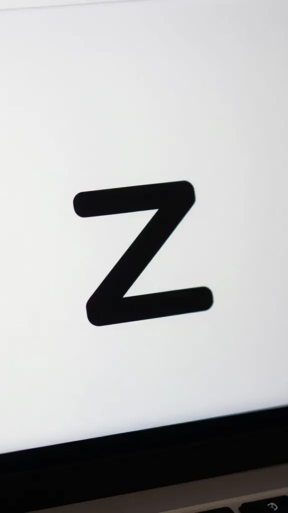 closeup of a single Zapier logo on a clean workspace, shallow DOF